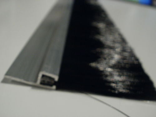 Scrapper style brush strip. Very stiff, made for conveyor belt, sweeping crud off.
