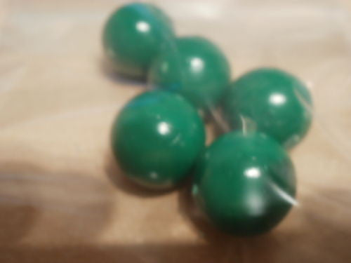 Pack of 5 green, 19mm diameter balls made of solid pvc.
