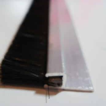 Standard size door draught excluder brush, sweeping strip that’s 890mm wide with 15mm trim.