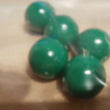 Green 19mm diameter balls, solid PVC. Will not float, games counters in schools.