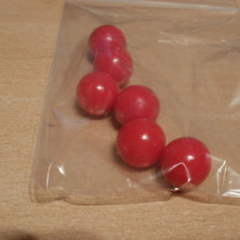 Red 19mm diameter balls, solid PVC. Will not float, games counters in schools.